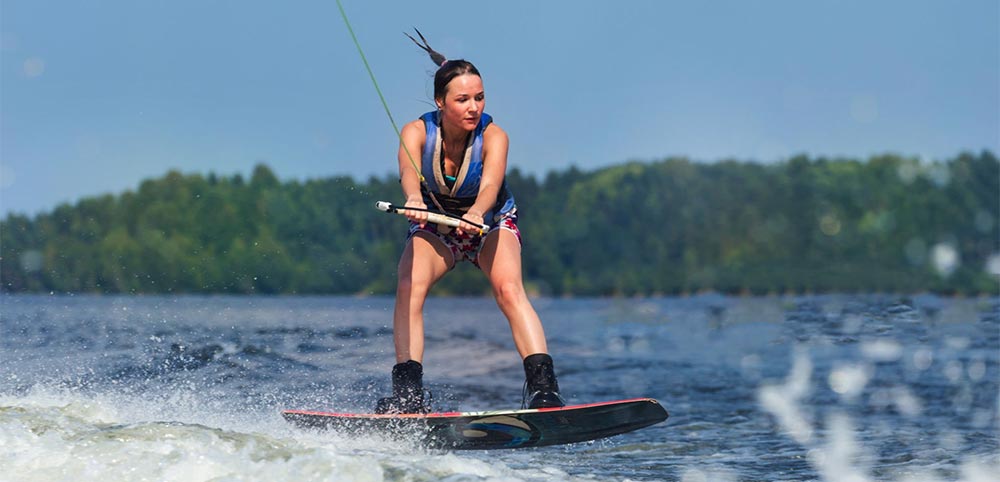 A Women riding a Wakeboard
