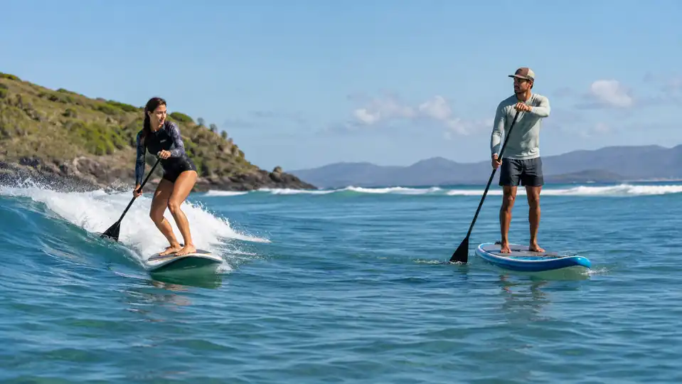 Surf and touring paddlers using different stand-up paddle lengths