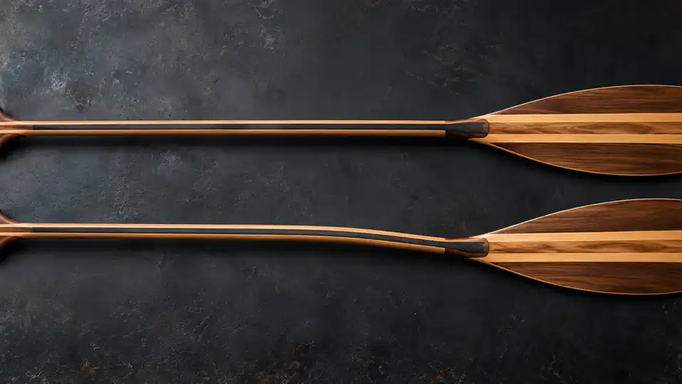 Side profile of matching straight and bent canoe paddle shafts